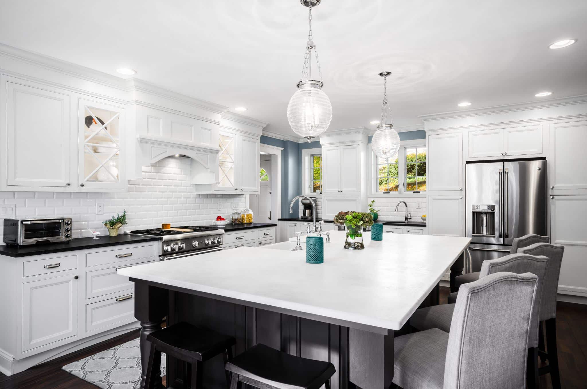 2015 DelCY Award wining kitchen featuring Bishop inset cabinetry and custom glass cabinet doors in Wynnewood, PA.