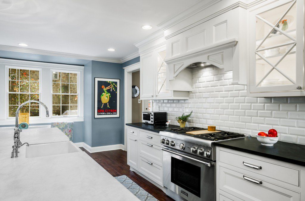 White painted brick helps brighten up this kitchen even more