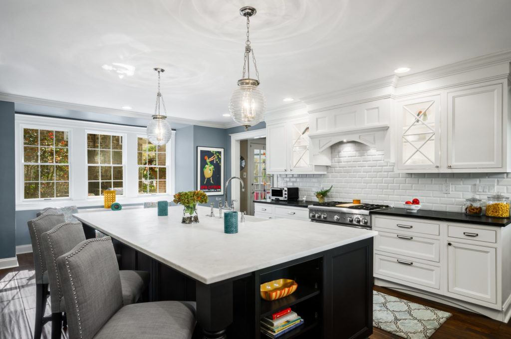 white kitchen with blue island 