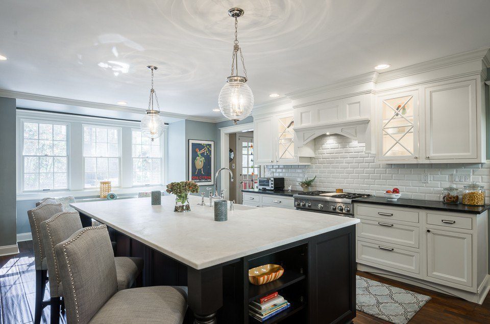 white kitchen with large blue island 