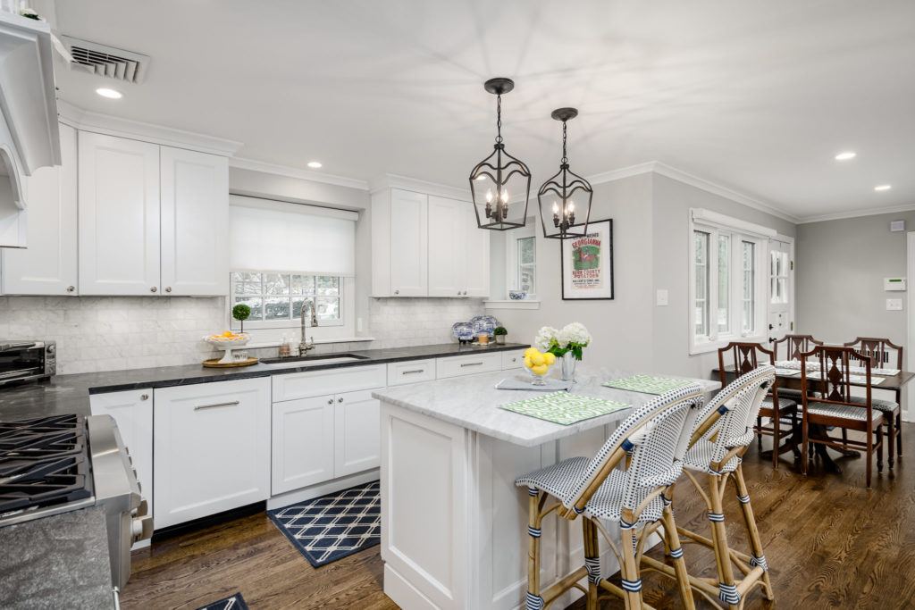 white kitchen with small island 