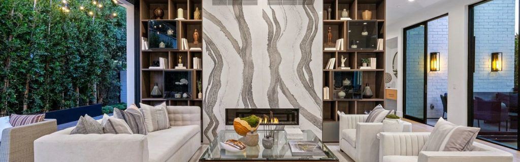 Cambria Brittanica kitchen countertop material used for the fireplace wall in this photo