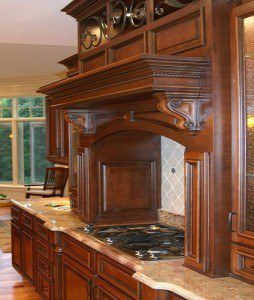 Decorative wooden hood around cooktop 