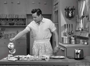 man pouring coffee in the kitchen 