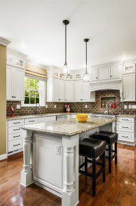 white kitchen with small island 