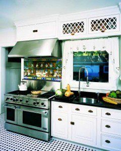 White kitchen with inset doors. The range is too close to the sink not providing enough workspace for an individual 