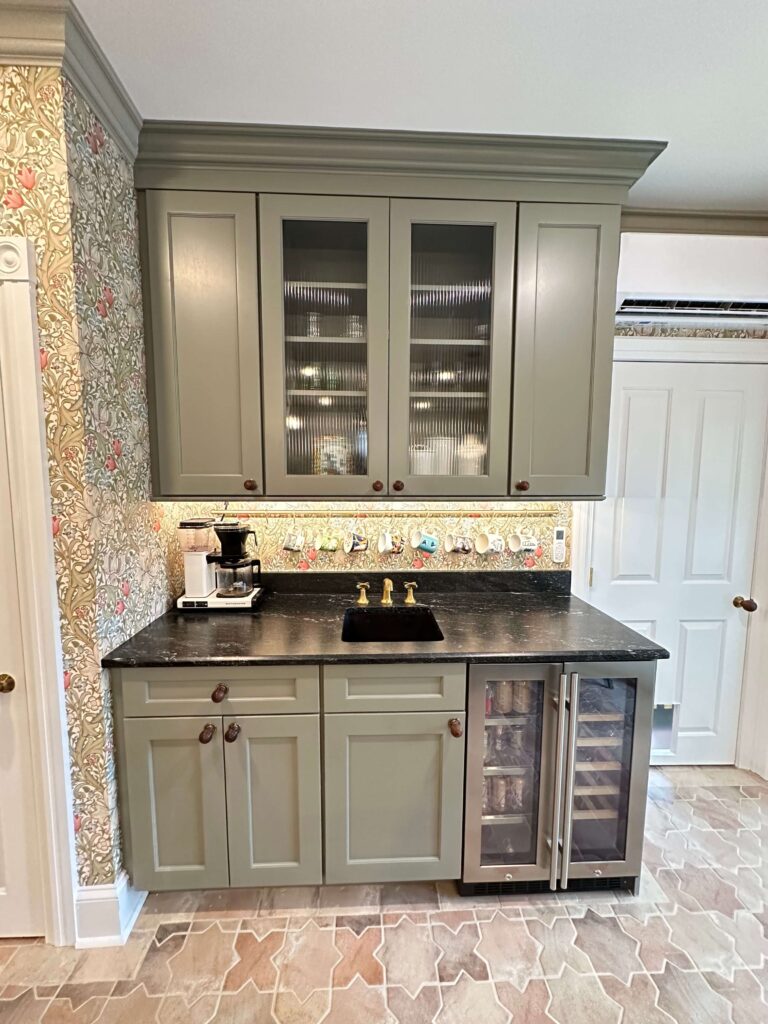 Color Matched Crown Moldings wrap around the room and this bar area.