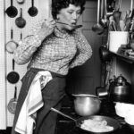 Portrait of Julie Child in kitchen.
