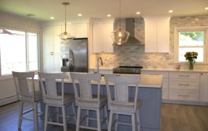 Modern White Kitchen with Marble Backsplash and Island