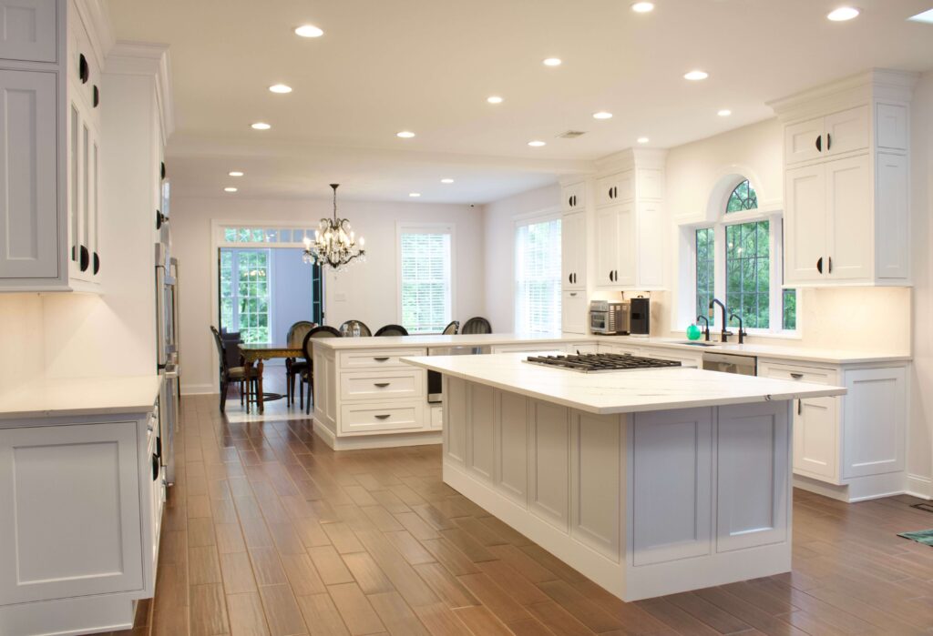 Brighton White beaded inset kitchen with cooktop in island.  West Chester PA kitchen so yes these are kitchen cabinets near me!