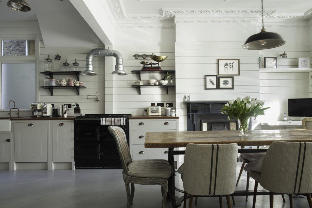 a more modern kitchen with dining room table 