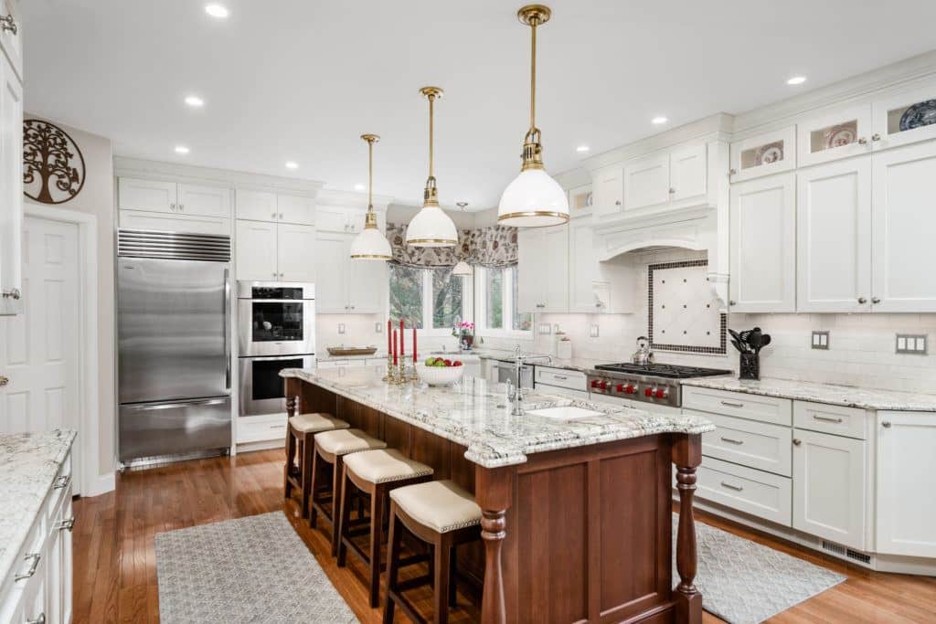 white kitchen with large island 