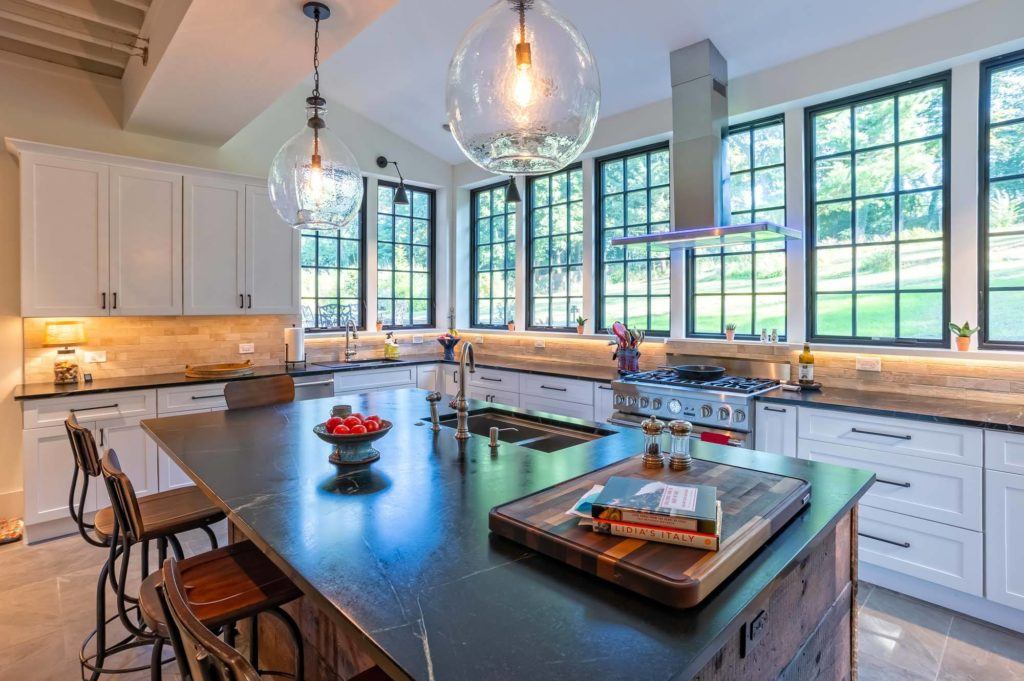 Barn kitchen with big open windows and a lot of natural lighting Shaker door style in Fabuwood Galaxy Frost