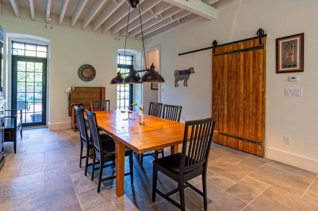 Barn door and dining room table. One of the popular kitchen remodeling costs