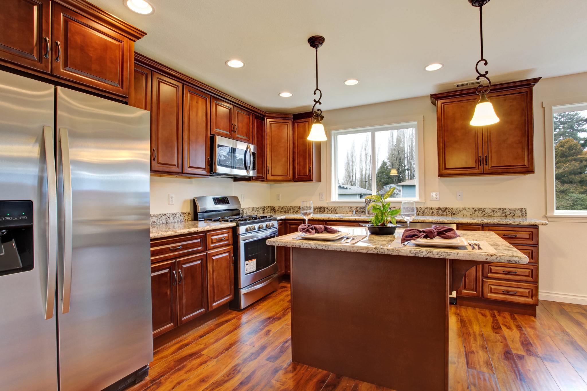 Kitchen with stained wood cabinets and an island 