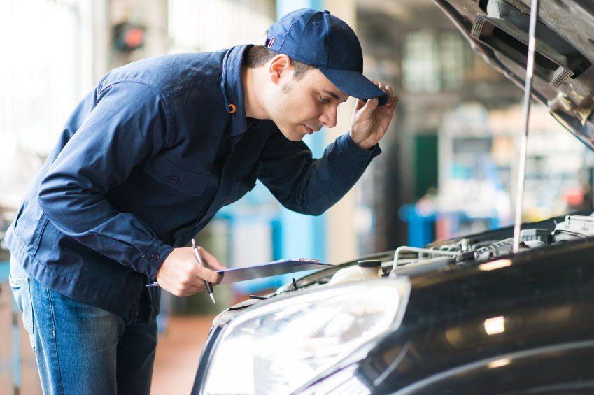 Man looking under hood