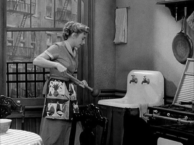 Alice Kramden from The Honeymooners cleaning her kitchen. Probably not a great memory, at least for her.