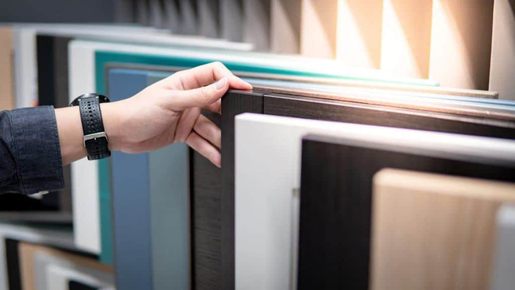 person looking through cabinet selection 
